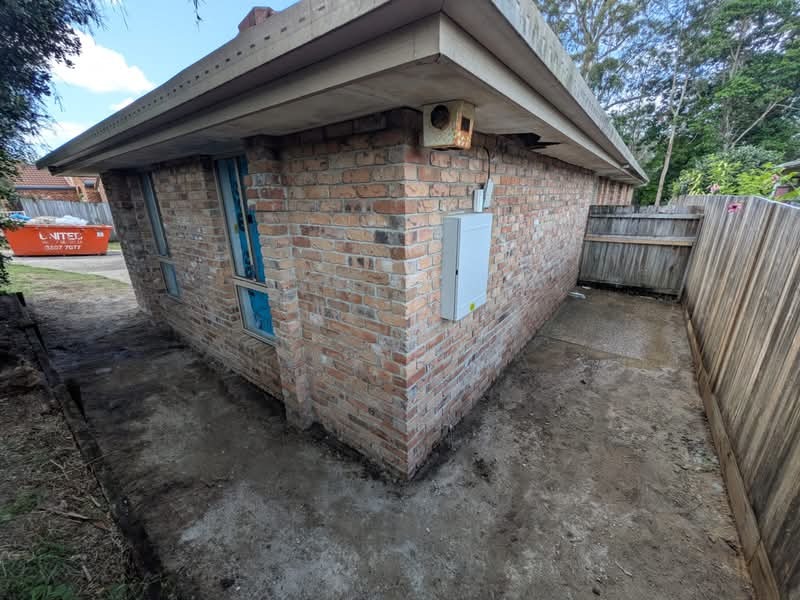 Brick wall repair on an older Gold Coast home.