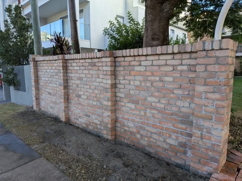 Red brick front fence under construction on the Gold Coast