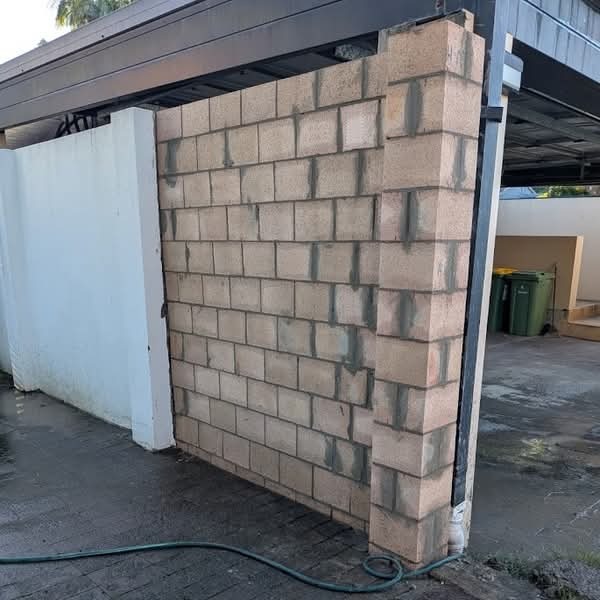 Side boundary block wall with a gate opening on the Gold Coast