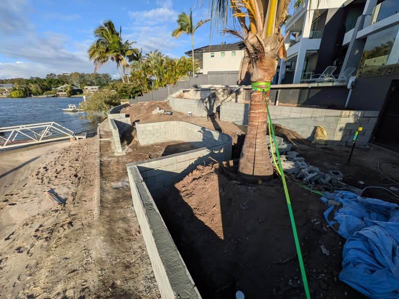 Curved block retaining wall on a Gold Coast waterfront property