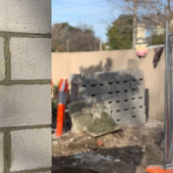 Image is of Gold Coast Pro Bricklayers working on a brick fence